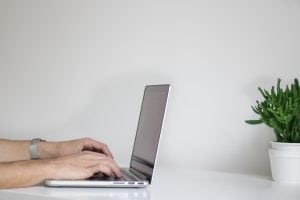 Hands on a laptop