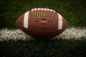 Football sitting on shelp