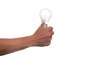 Person holding lightbulb