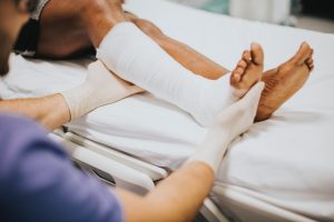 Nurse tended to a patient's broken leg