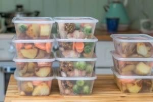 Meal prep. Stack of home cooked roast chicken dinners in containers ready to be frozen for later use as quick and easy ready meals.