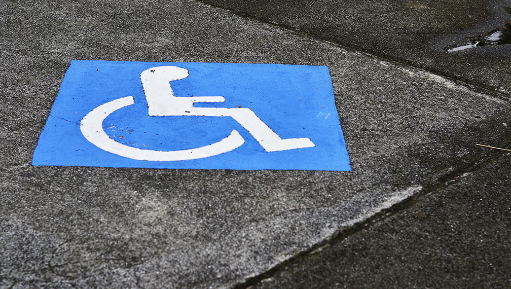 Accessibility symbol on sidewalk