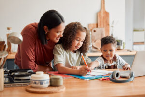 Homeschool, education and distance learning for children while mother, parent and woman helps son and daughter. Teaching, talking and bonding with kids doing home school, homework and learning test